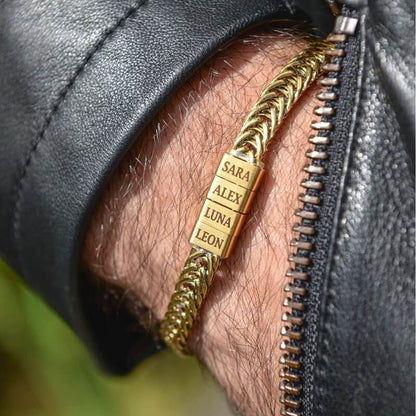 Gold personalized bracelet with engraved family name beads on a man's wrist