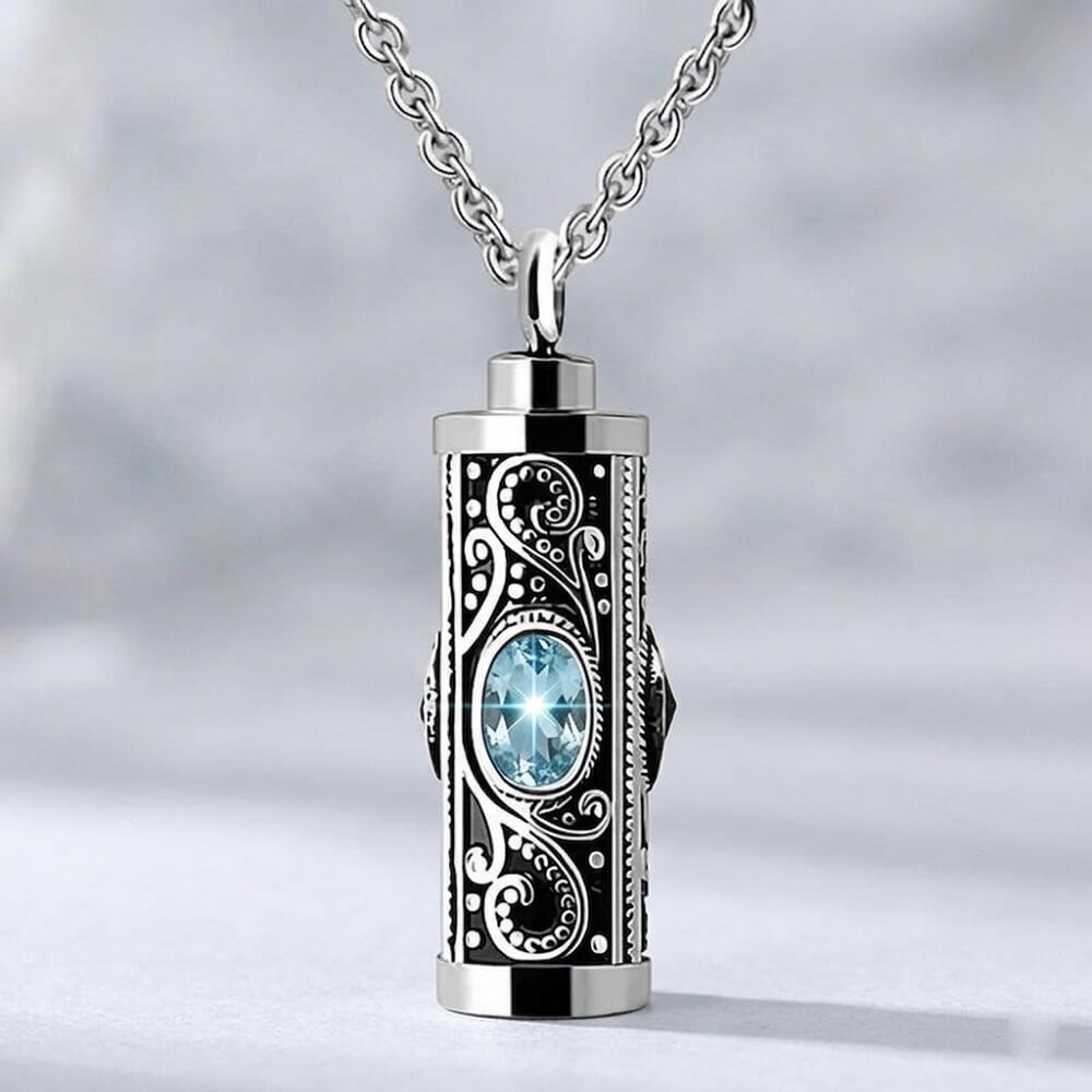 March birthstone aquamarine light blue crystal urn necklace for human pet ashes, engraved filigree cylinder memorial pendant jewelry.