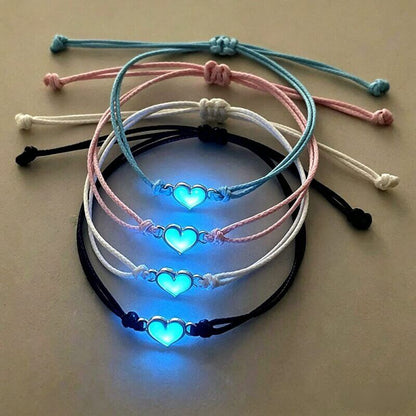 Set of 4 matching glow-in-the-dark heart bracelets in blue, pink, white, and black for best friends.