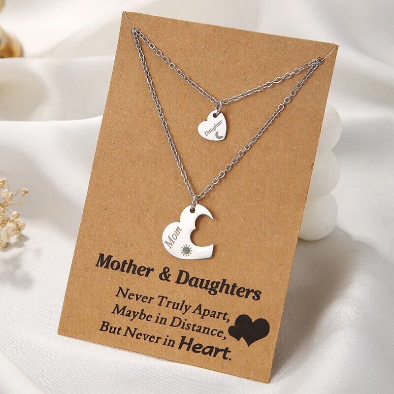 Mother and daughter jewelry set displayed on a kraft paper gift card with the quote Never Truly Apart, Maybe in Distance, But Never in Heart.