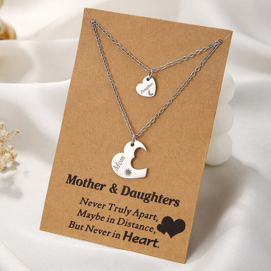 Mother and daughter jewelry set displayed on a kraft paper gift card with the quote Never Truly Apart, Maybe in Distance, But Never in Heart.