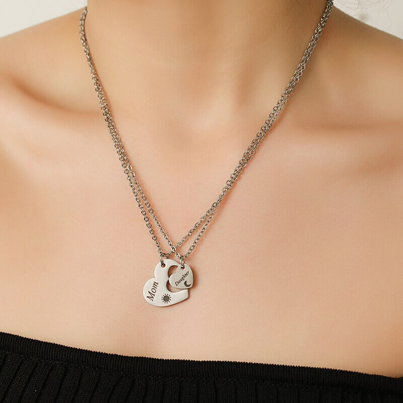 Close-up of high-quality stainless steel heart necklaces for mom and daughter, designed as a meaningful long-distance relationship gift.